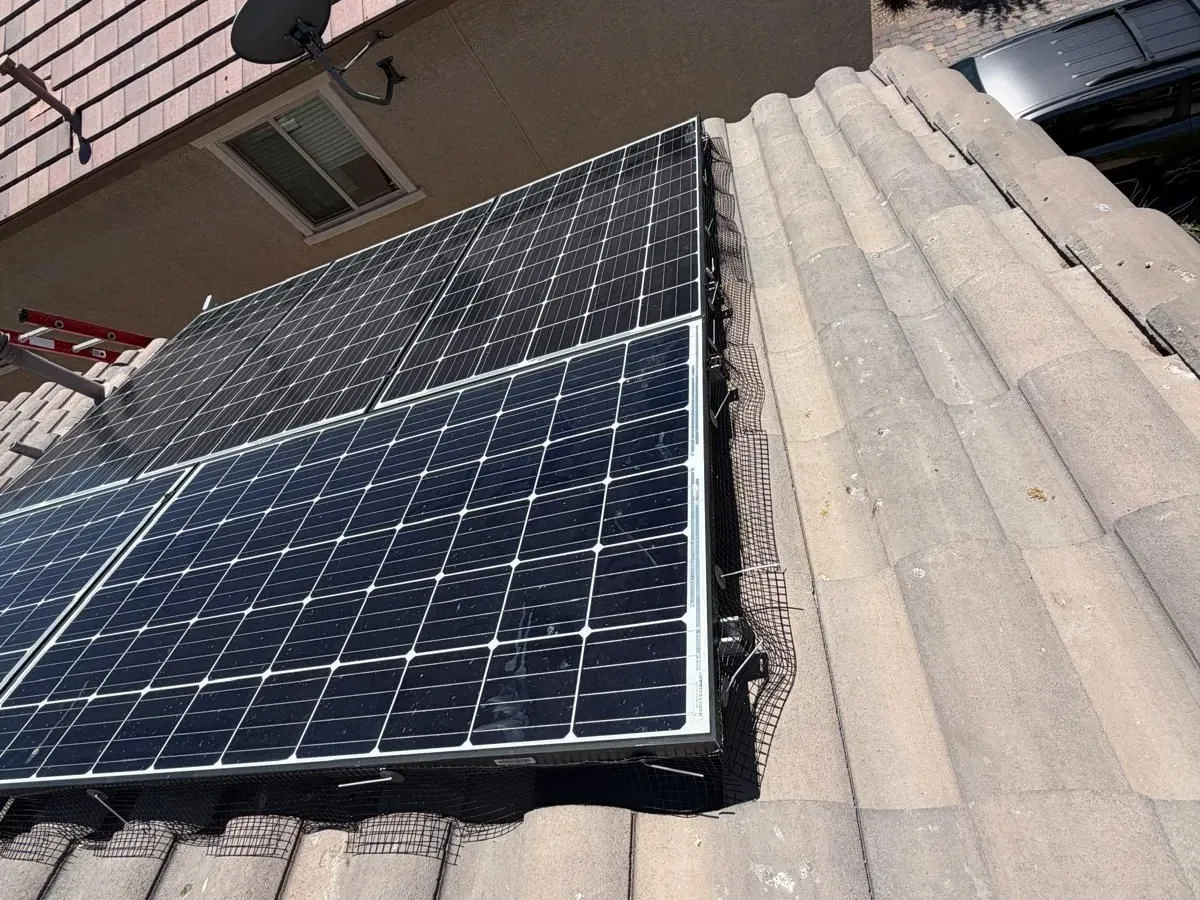 Solar panels on a Las Vegas tile roof with the perimeter sealed against birds