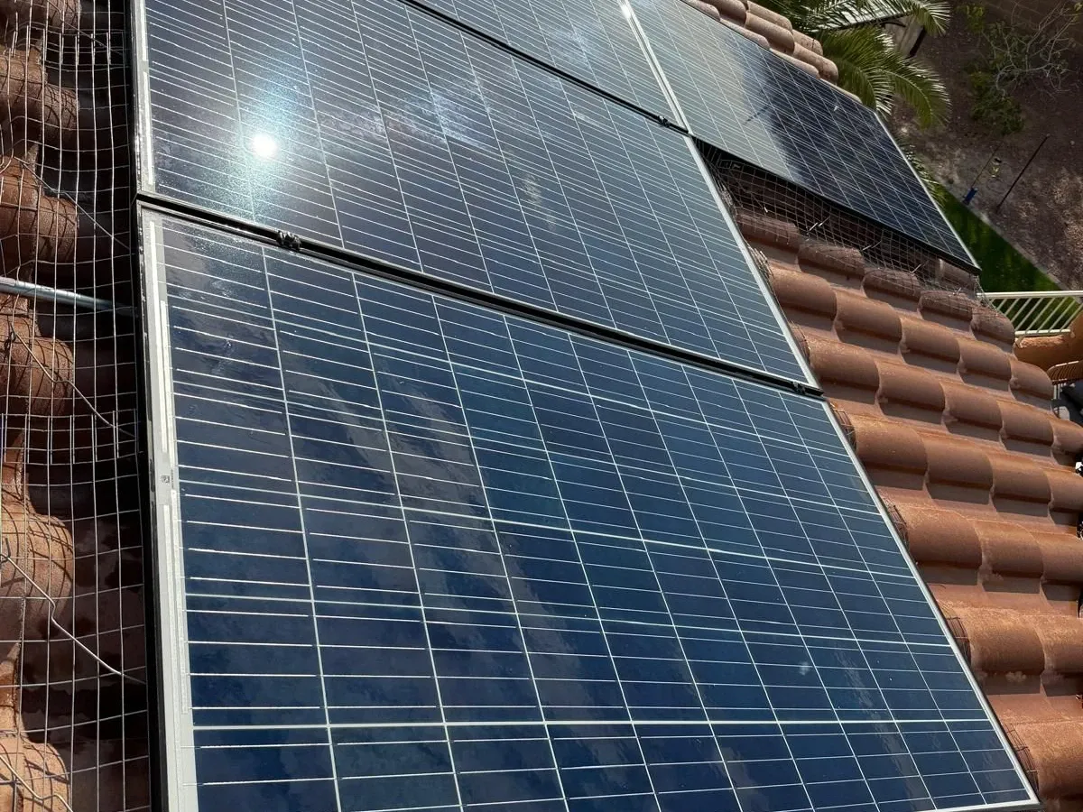 Galvanized steel bird mesh fitted along the lower edge of a solar array